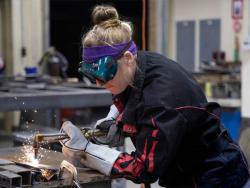 HCC student working on a welding project for their program