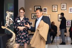 A man and a woman looking at a sculpture in an art gallery